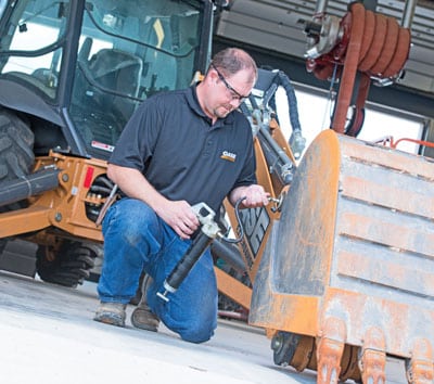Greasing a backhoe