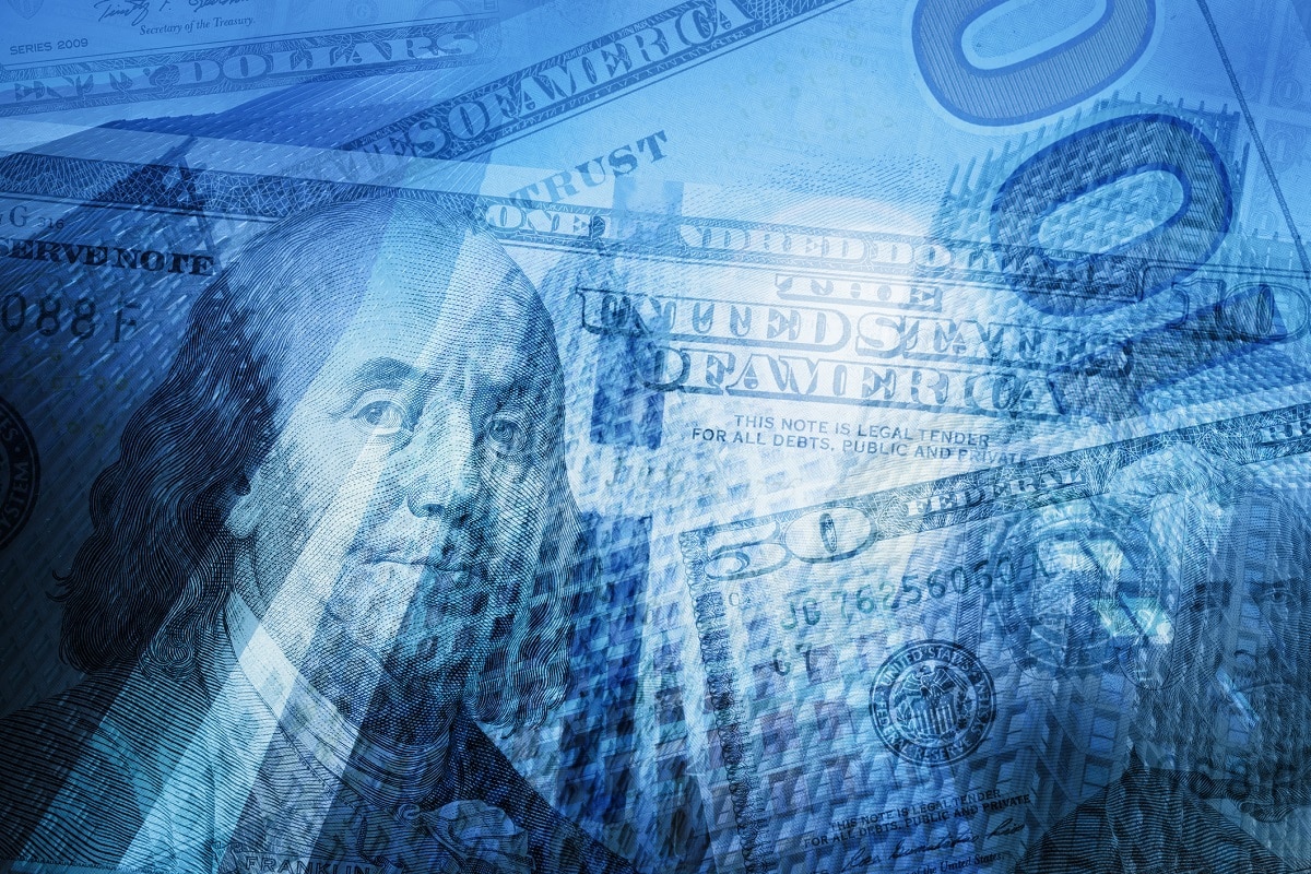Money is translucent over a buildings with a blue tint