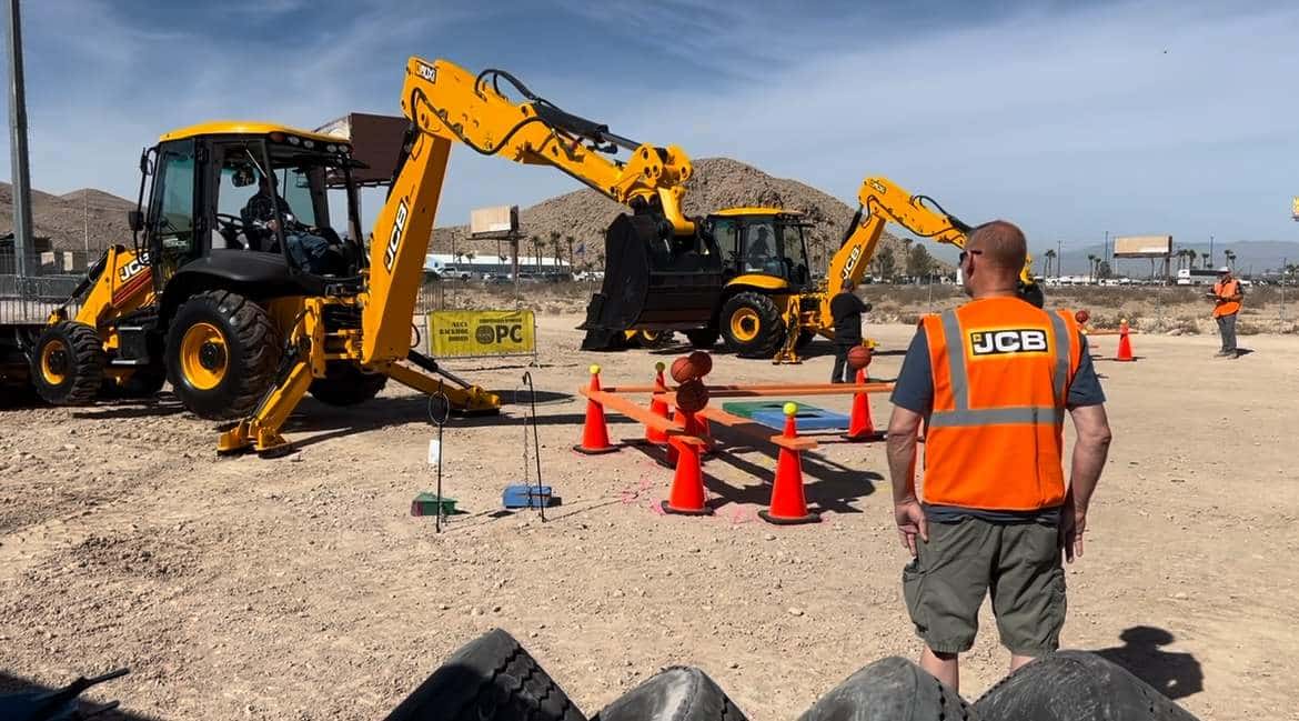 NUCA Backhoe Rodeo judge watching backhoe operator