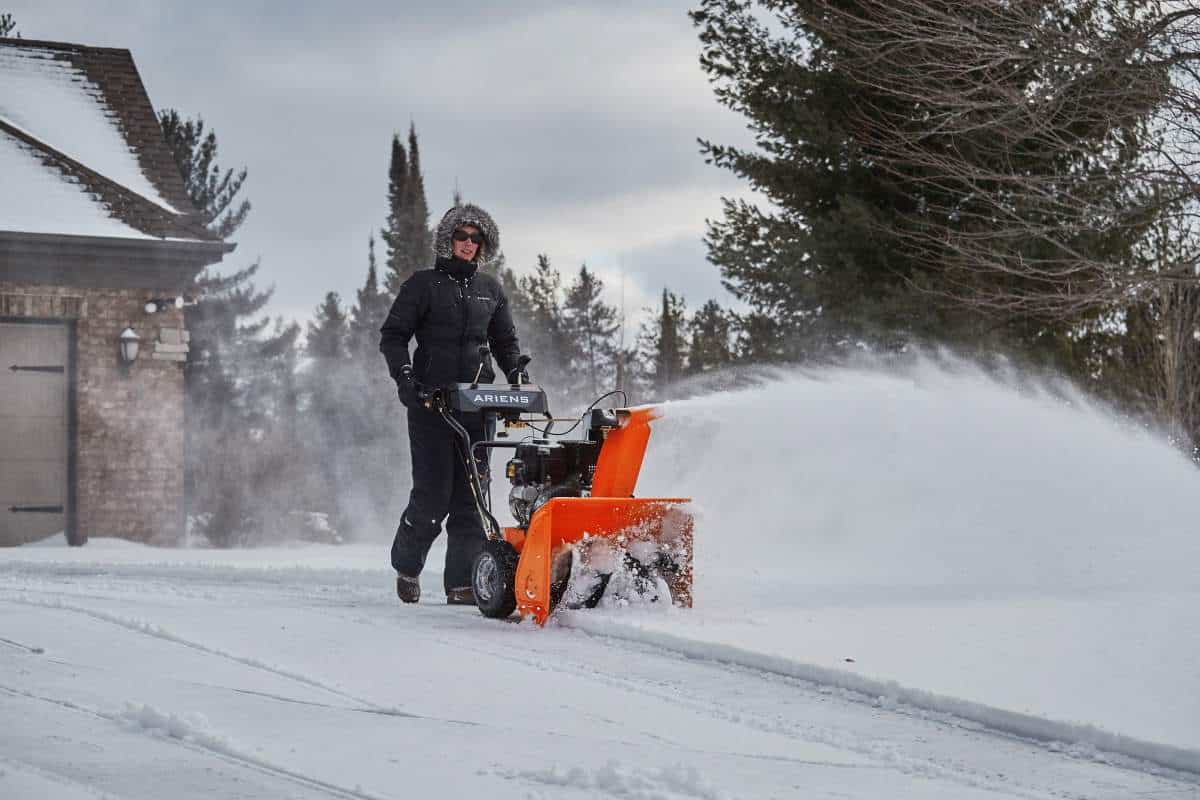 Ariens snow thrower working in the snow